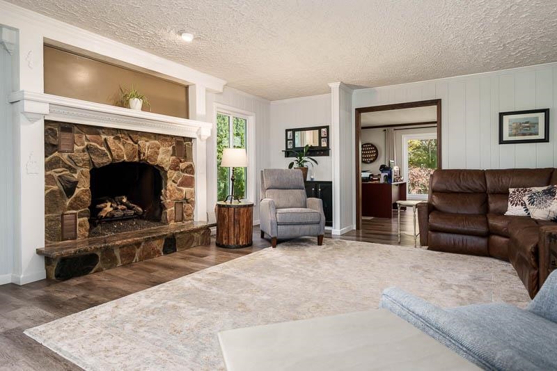 11948 Southgate Road Roscoe, IL 61073 - Photo 17 of 73 a living room with furniture and a fireplace