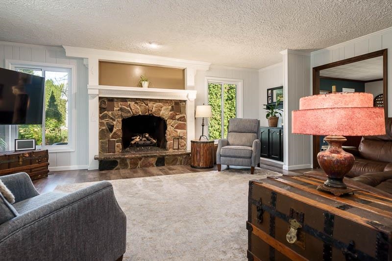 11948 Southgate Road Roscoe, IL 61073 - Photo 18 of 73 a living room with furniture and a fireplace