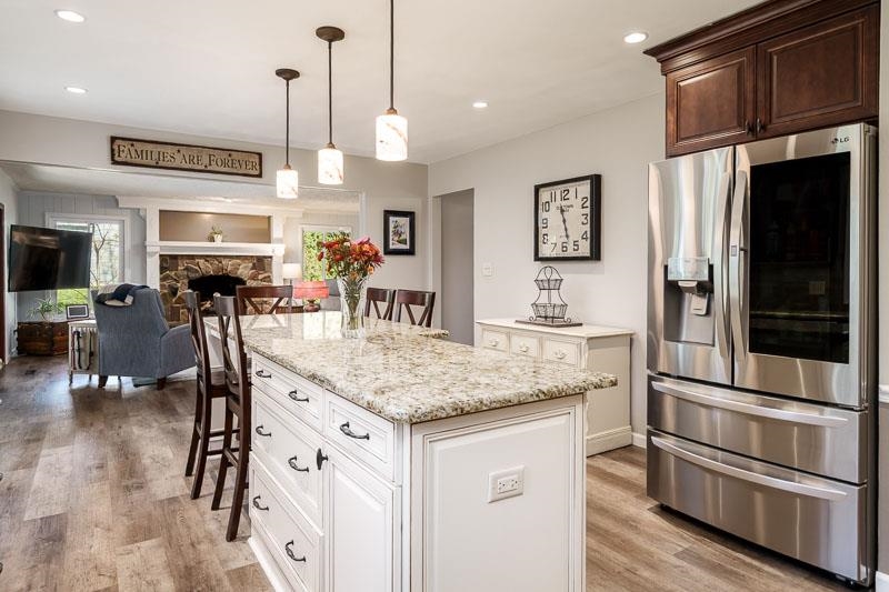 11948 Southgate Road Roscoe, IL 61073 - Photo 20 of 73 a kitchen with stainless steel appliances granite countertop a stove and a sink