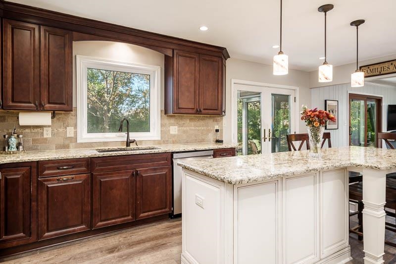 11948 Southgate Road Roscoe, IL 61073 - Photo 22 of 73 a kitchen with stainless steel appliances granite countertop a sink a stove and a wooden cabinets
