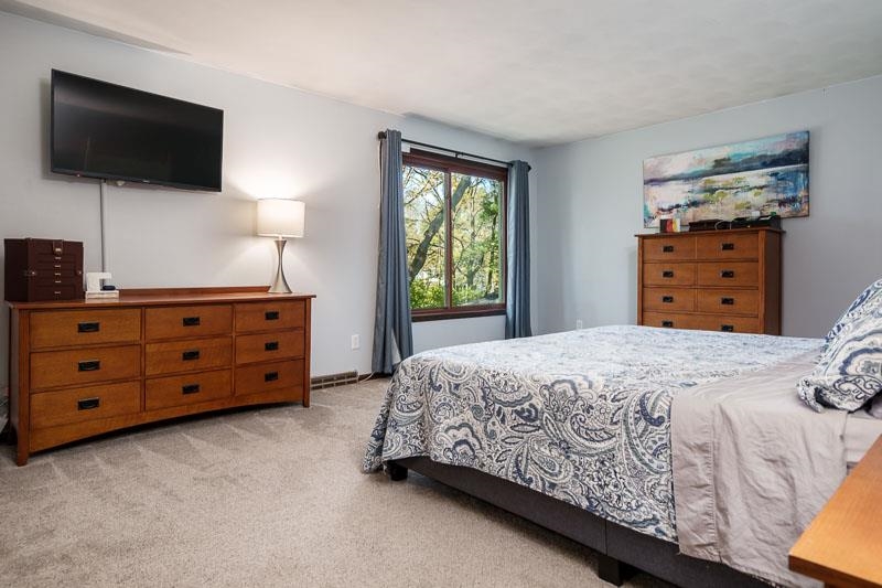 11948 Southgate Road Roscoe, IL 61073 - Photo 28 of 73 a bedroom with a bed and a flat screen tv