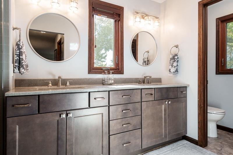 11948 Southgate Road Roscoe, IL 61073 - Photo 31 of 73 a bathroom with a double vanity sink and a mirror