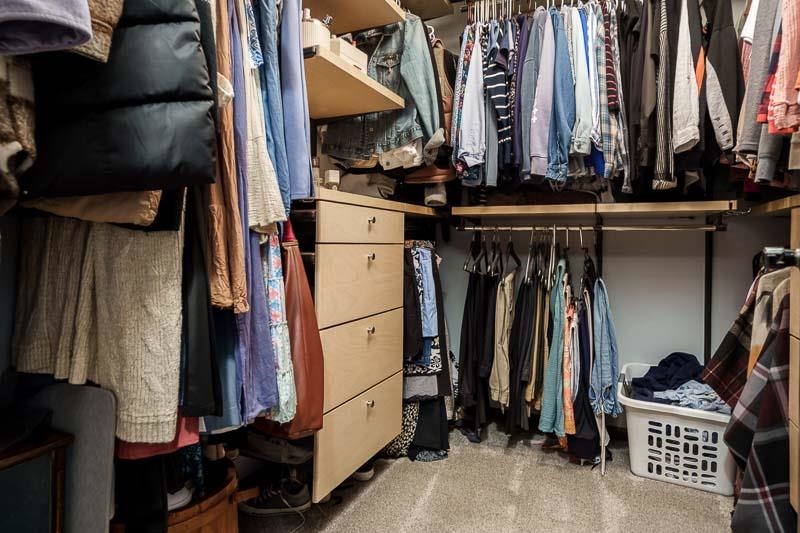 11948 Southgate Road Roscoe, IL 61073 - Photo 33 of 73 a view of walk in closet with clothes and shoes
