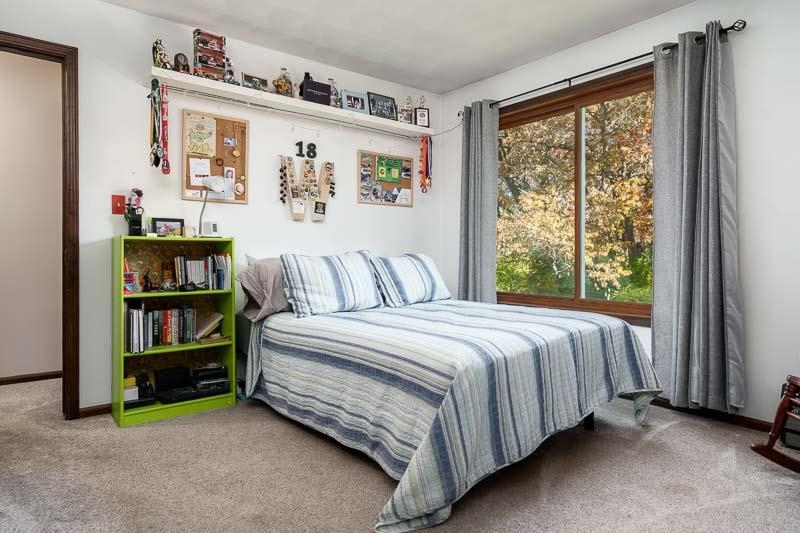 11948 Southgate Road Roscoe, IL 61073 - Photo 35 of 73 a spacious bedroom with a bed and a large window