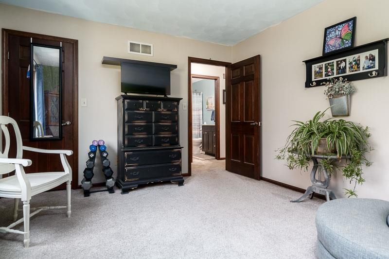11948 Southgate Road Roscoe, IL 61073 - Photo 38 of 73 a living room with furniture and a flat screen tv