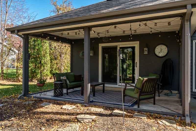 11948 Southgate Road Roscoe, IL 61073 - Photo 50 of 73 a view of a porch with furniture and a window