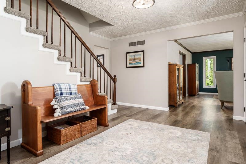 11948 Southgate Road Roscoe, IL 61073 - Photo 5 of 73 a view of an entryway with wooden floor and stairs