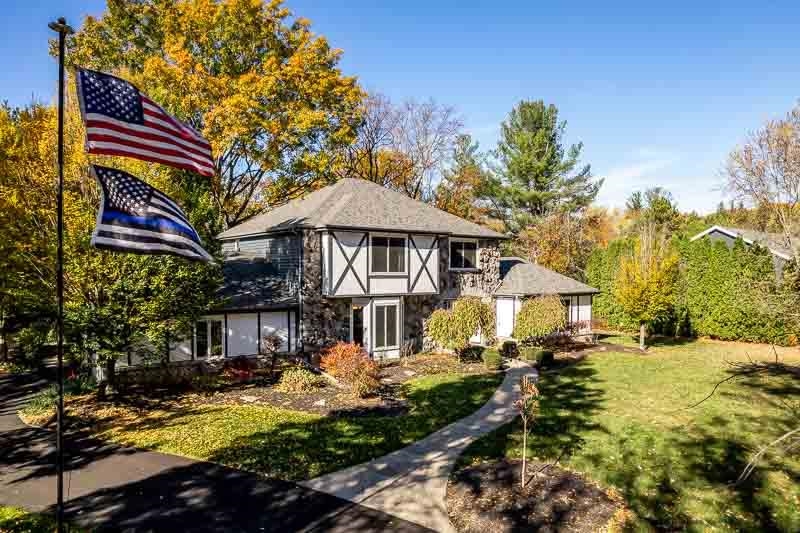 11948 Southgate Road Roscoe, IL 61073 - Photo 71 of 73 a front view of a house with garden