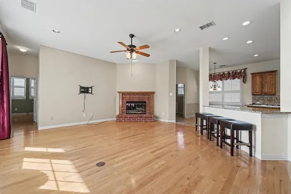 a view of kitchen with cabinets and wooden floor