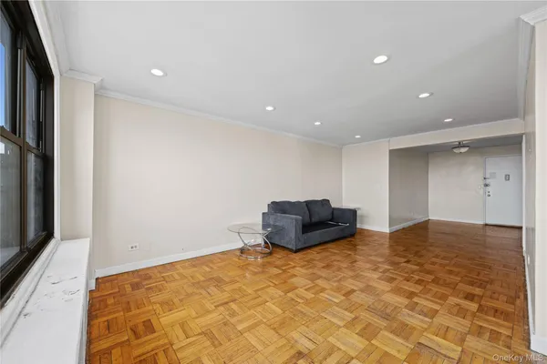 a bedroom with a bed and a dresser in it