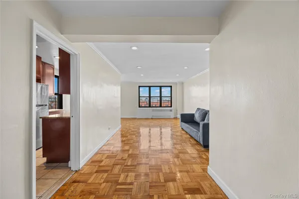 a hallway with windows and closet