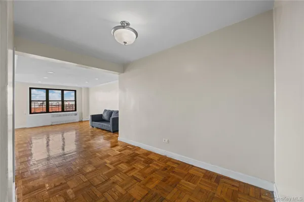 a view of an empty room with windows