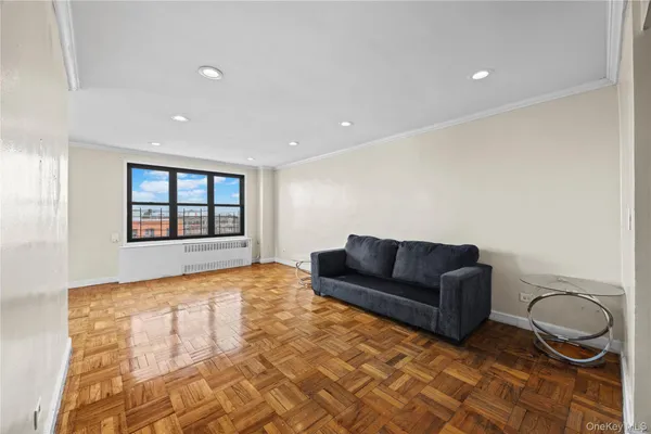 a living room with a couch and a window