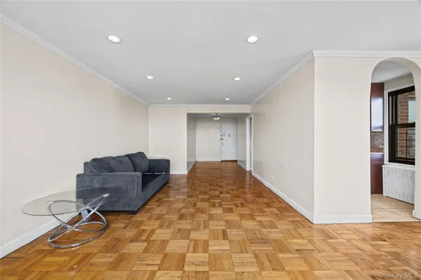 a living room with furniture and a rug