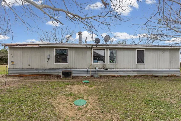 a view of a house with a big yard