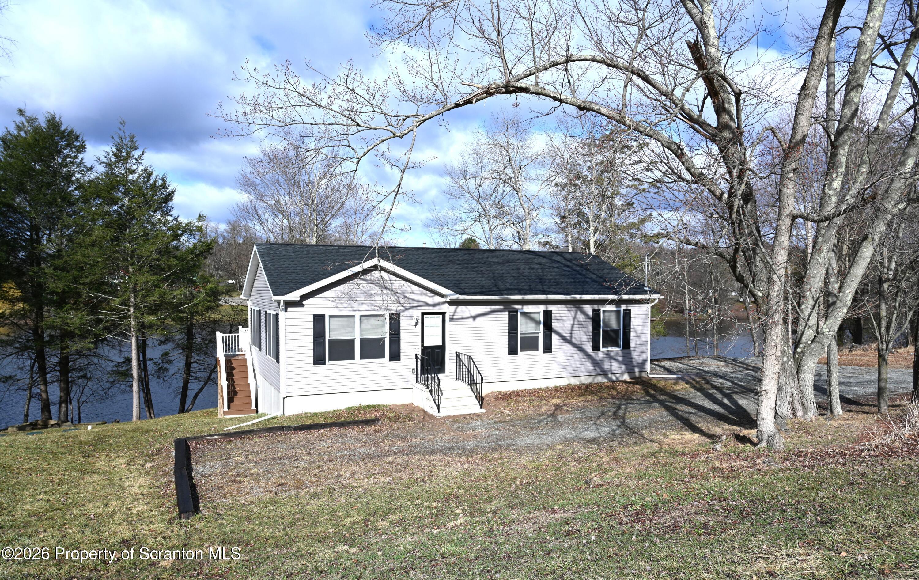 1143 Highway 29 Springville, PA 18844 - Photo 1 of 44 front view of a house with a yard