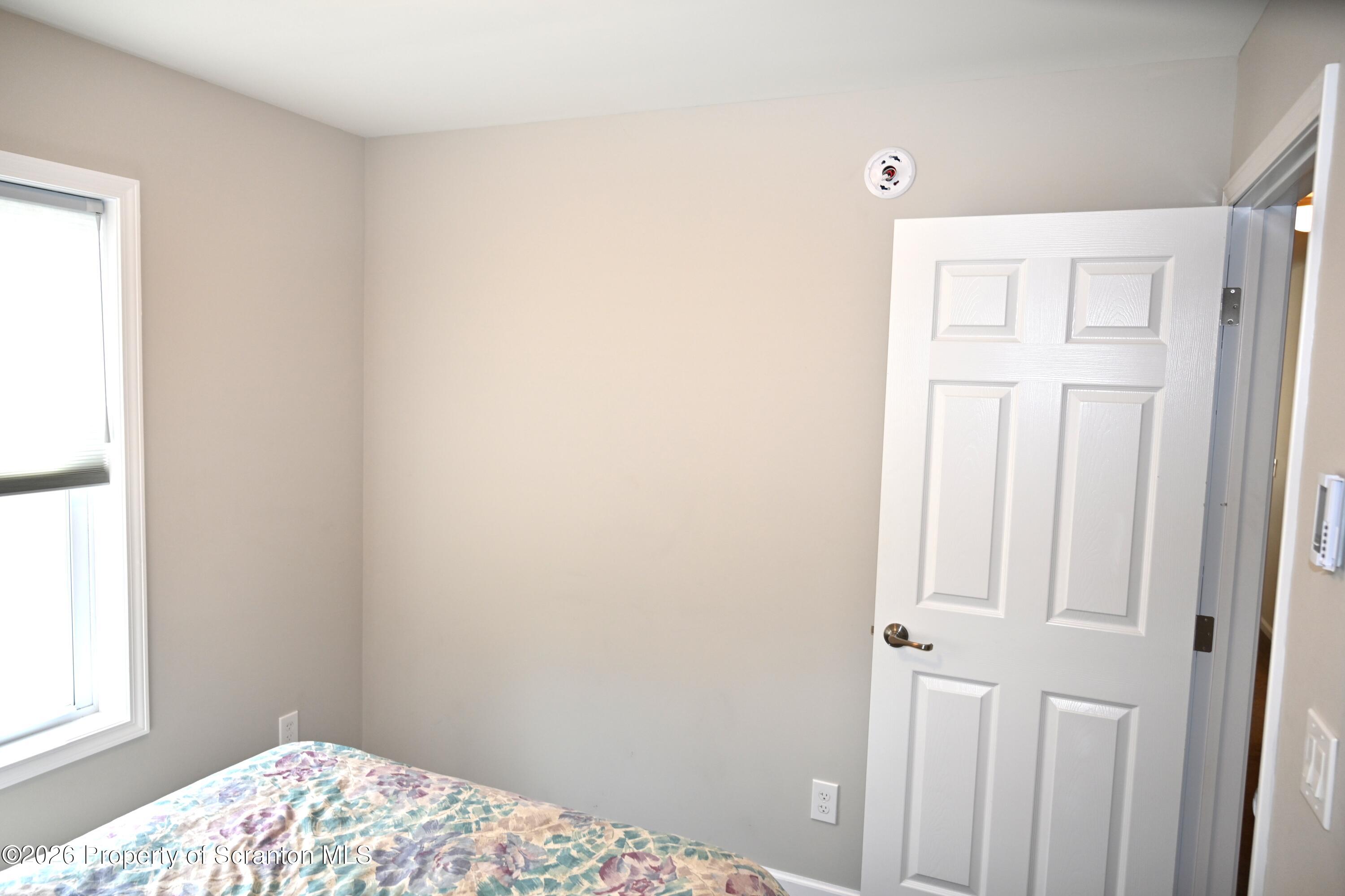 1143 Highway 29 Springville, PA 18844 - Photo 17 of 44 a bedroom with a bed and a window