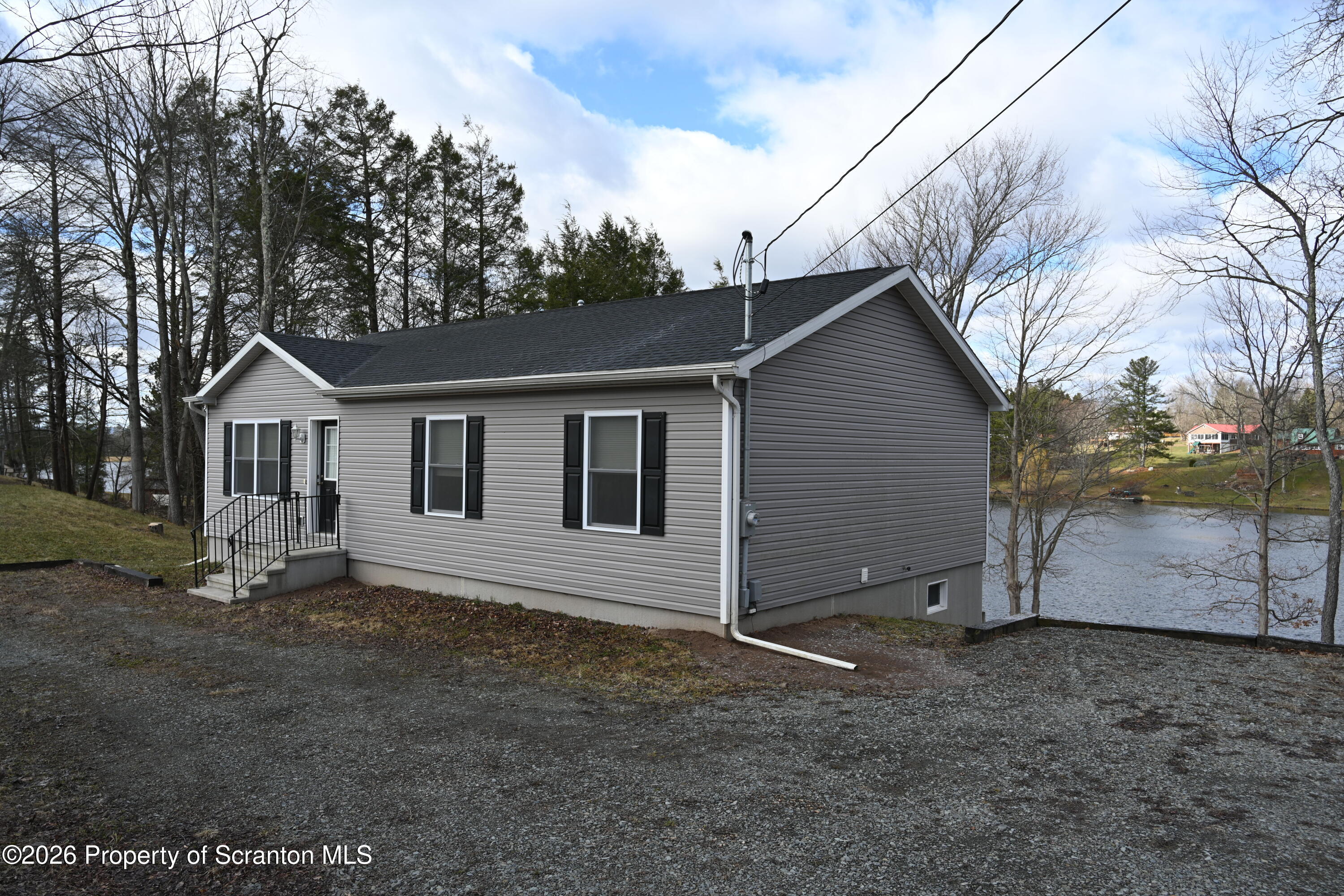 1143 Highway 29 Springville, PA 18844 - Photo 25 of 44 a front view of a house with a yard