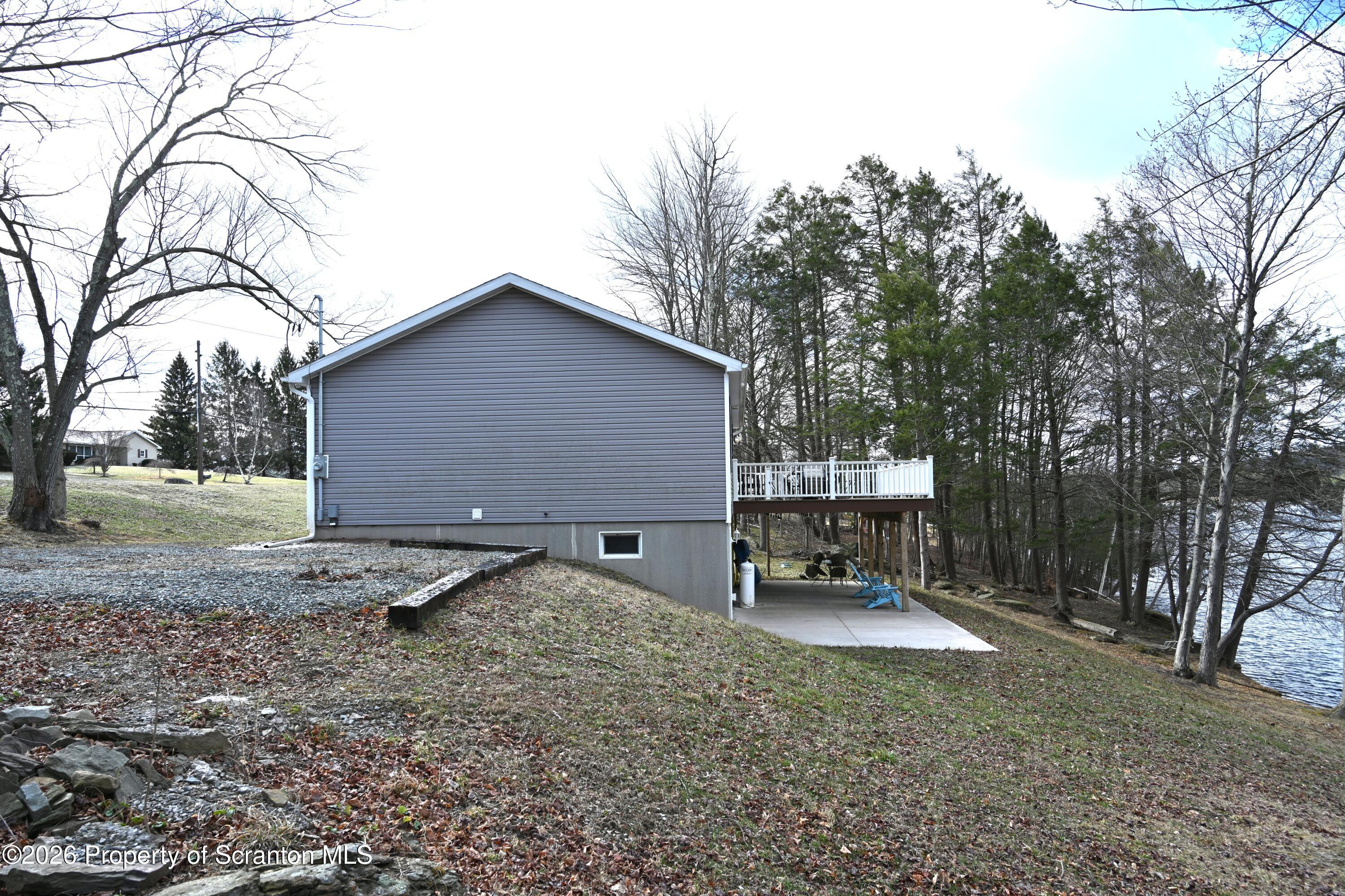 1143 Highway 29 Springville, PA 18844 - Photo 26 of 44 a view of a house with backyard and trees