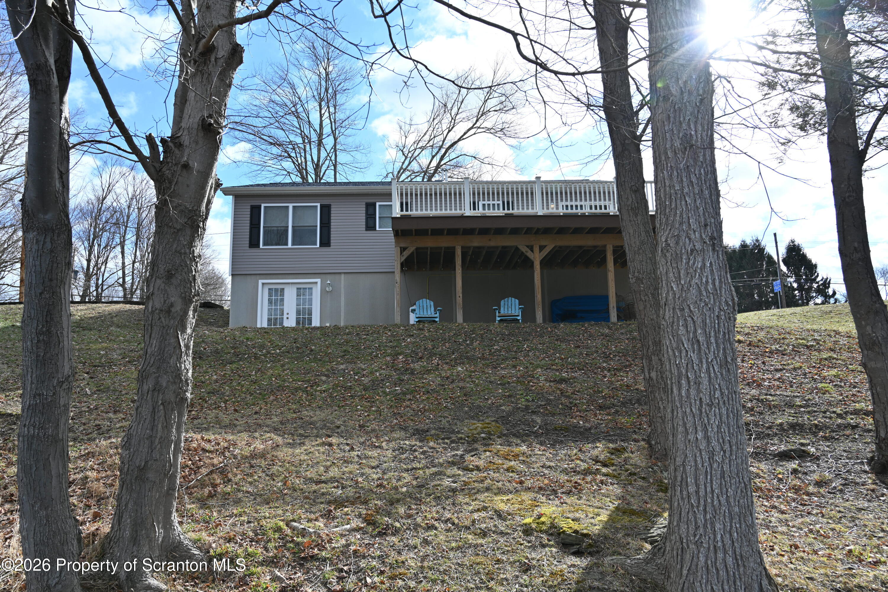 1143 Highway 29 Springville, PA 18844 - Photo 28 of 44 a view of a house with a tree in front of it