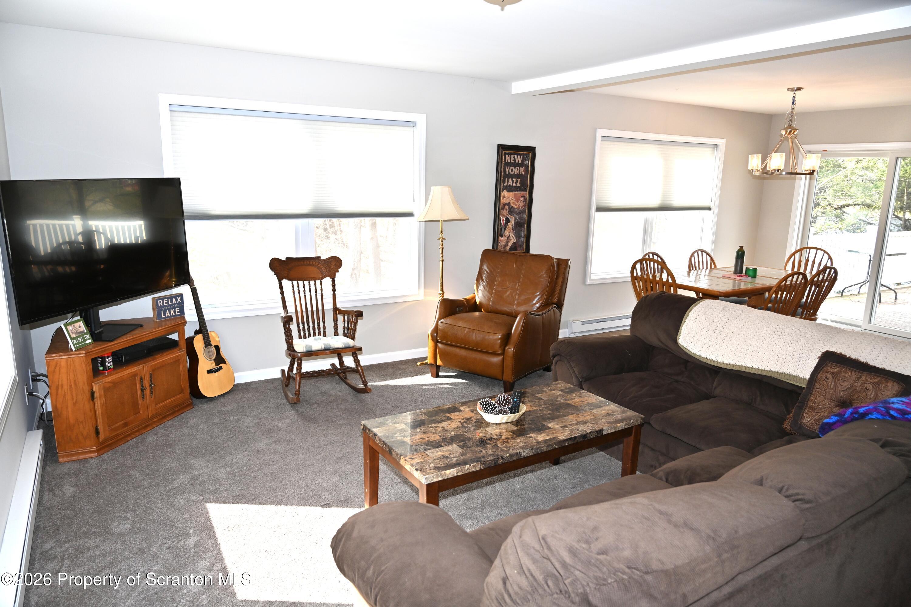 1143 Highway 29 Springville, PA 18844 - Photo 10 of 44 a living room with furniture and a flat screen tv