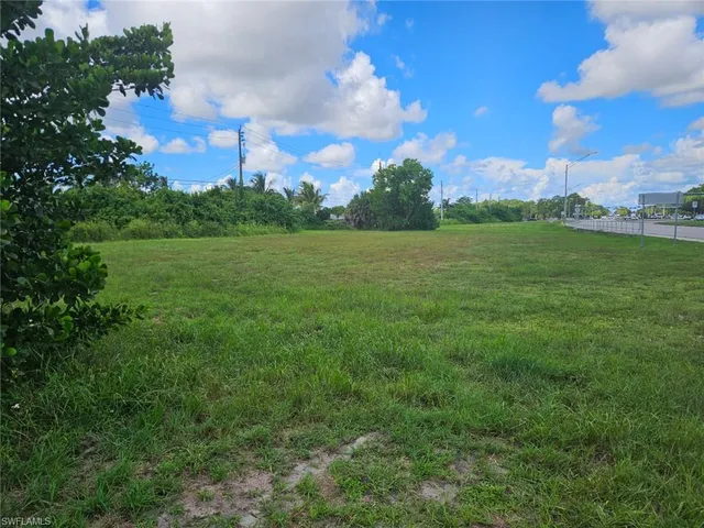 a view of field with ocean view