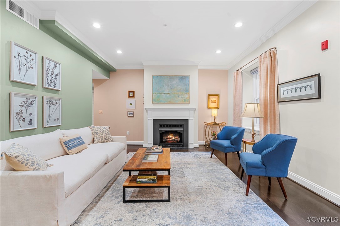 413 Stuart Circle, Unit PLD Richmond, VA 23220 - Photo 12 of 47 a living room with furniture a rug and a fireplace