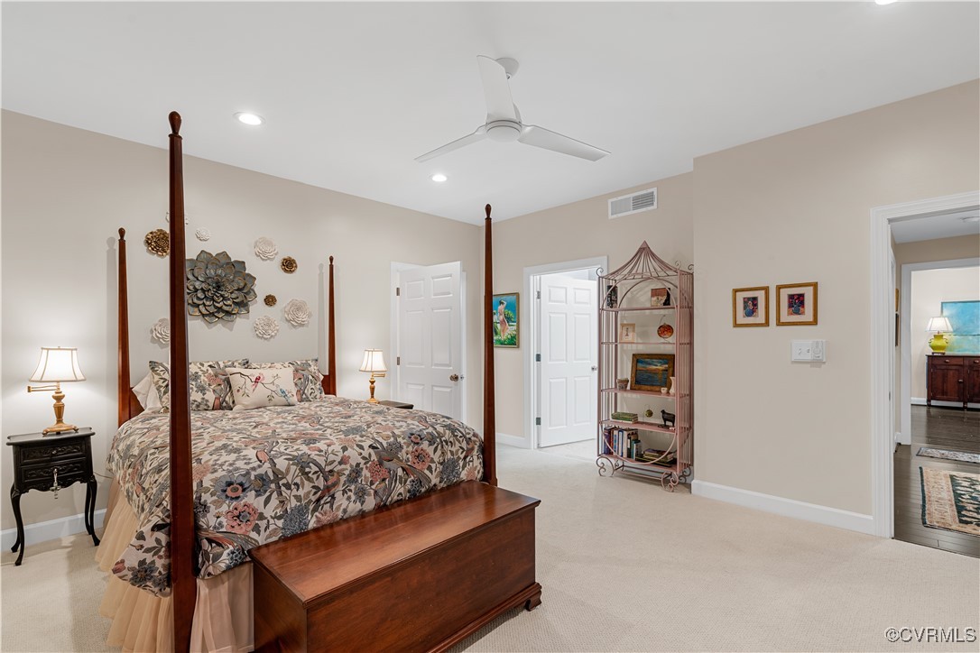 413 Stuart Circle, Unit PLD Richmond, VA 23220 - Photo 18 of 47 a bedroom with a bed chandelier and a window