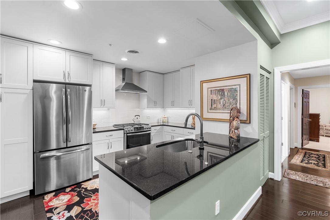 413 Stuart Circle, Unit PLD Richmond, VA 23220 - Photo 2 of 47 a kitchen with stainless steel appliances granite countertop a refrigerator a sink a stove and a refrigerator with wooden floor
