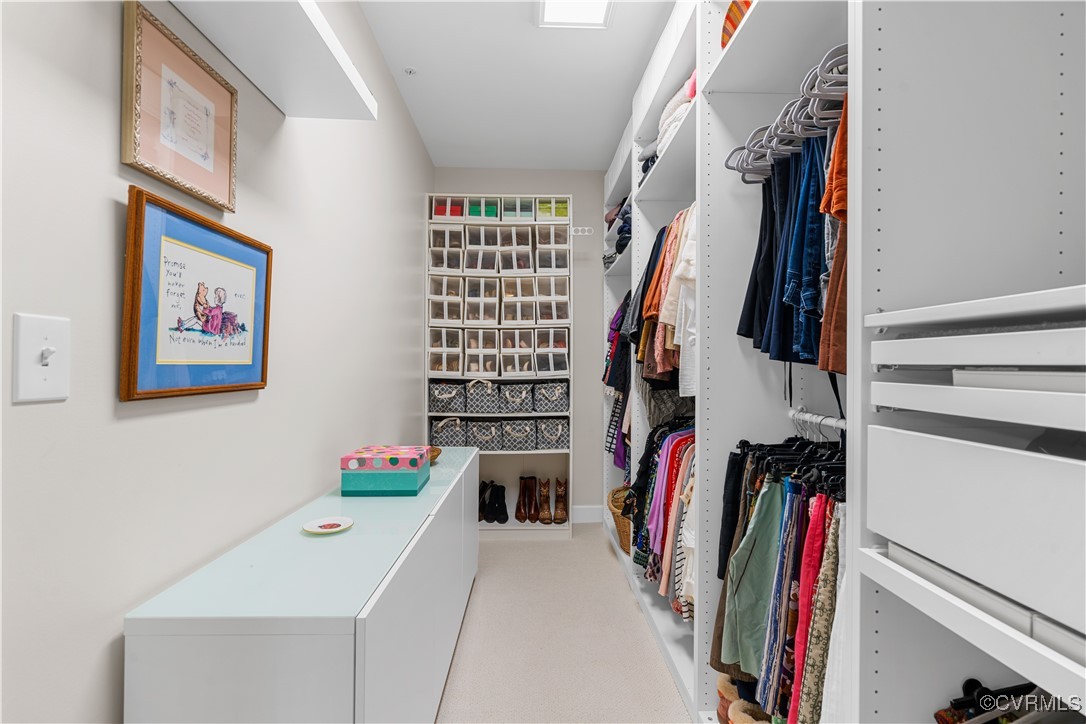 413 Stuart Circle, Unit PLD Richmond, VA 23220 - Photo 21 of 47 a view of walk in closet with clothes and shoes
