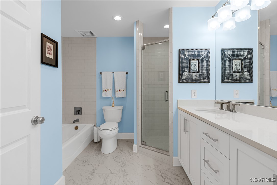 413 Stuart Circle, Unit PLD Richmond, VA 23220 - Photo 22 of 47 a bathroom with a toilet sink and mirror