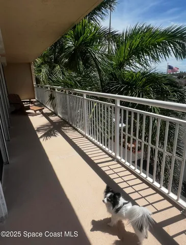 a kitchen with granite countertop white cabinets and a stove