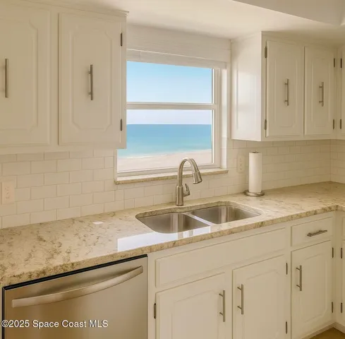 a kitchen with granite countertop a sink and cabinets