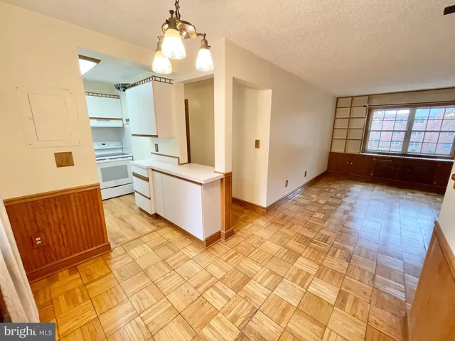 a kitchen with a refrigerator and a stove
