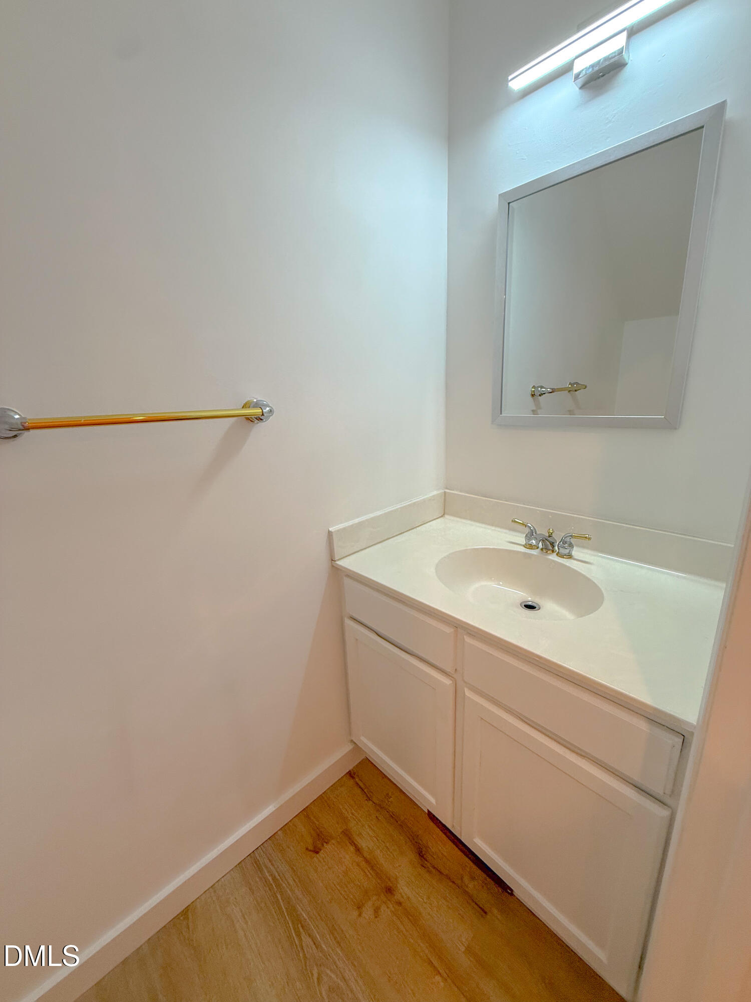 4247 The Oaks Drive Raleigh, NC 27606 - Photo 12 of 21 a bathroom with a sink and a mirror