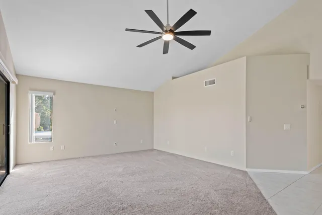 a view of room with ceiling fan