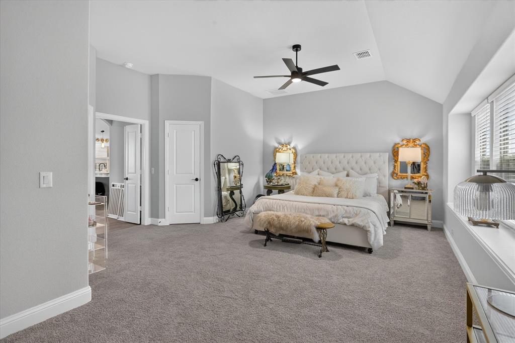 833 Godley Ranch Godley, TX 76044 - Photo 13 of 31 Carpeted room featuring a vaulted ceiling with a ceiling fan, a window with horizontal blinds, and white trim throughout