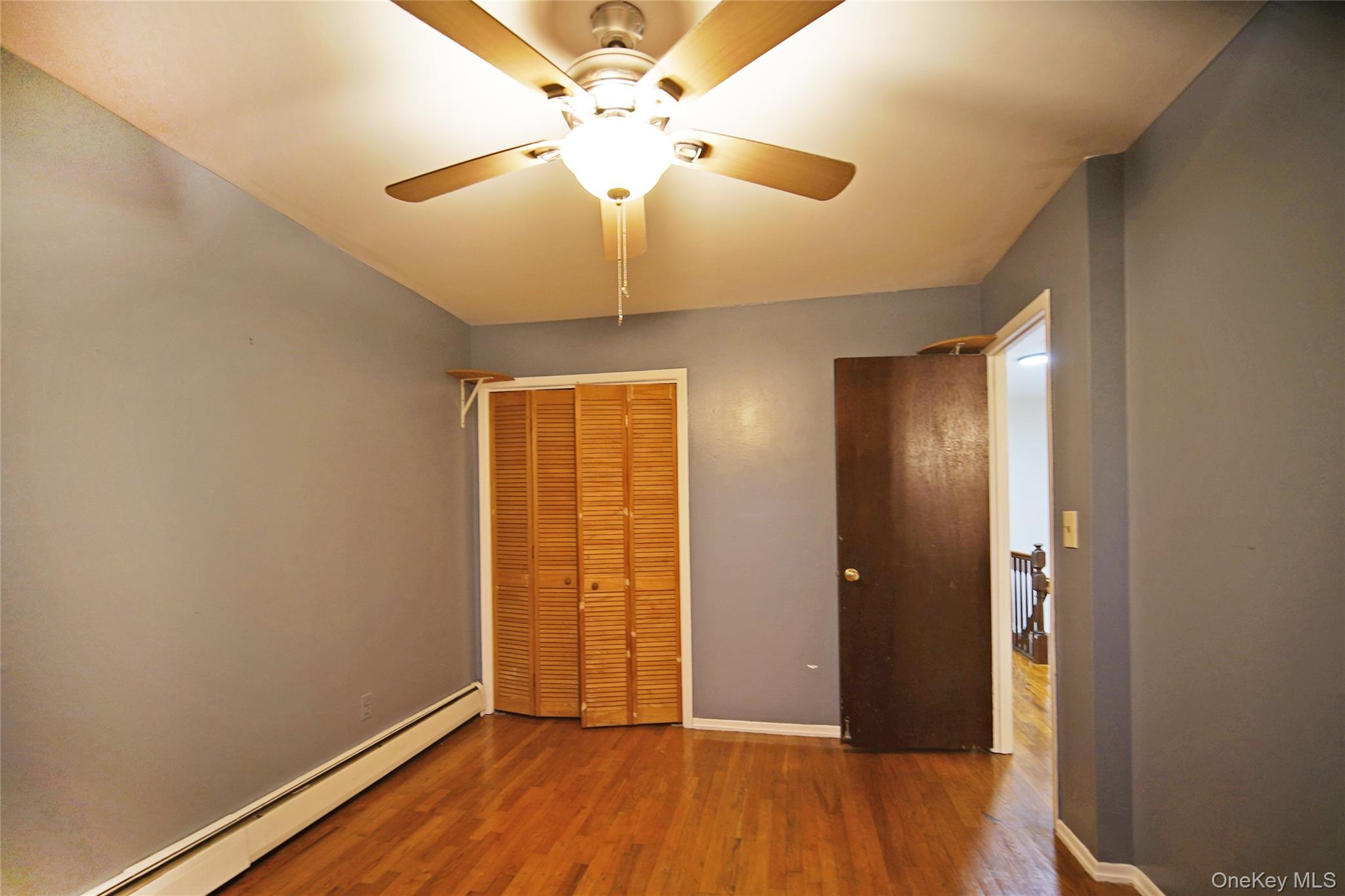 1280 Adee Avenue Bronx, NY 10469 - Photo 5 of 11 wooden floor in an empty room with a window