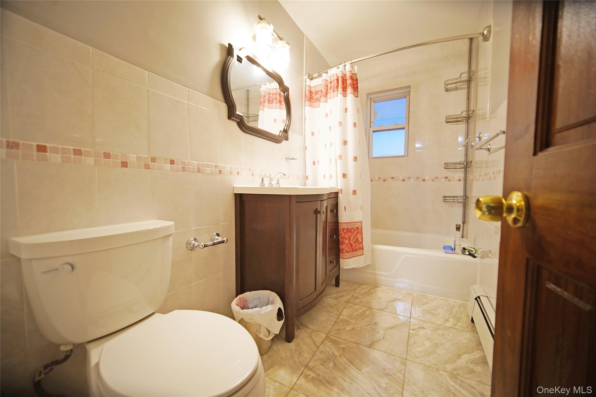 1280 Adee Avenue Bronx, NY 10469 - Photo 7 of 11 a bathroom with a sink a toilet and shower
