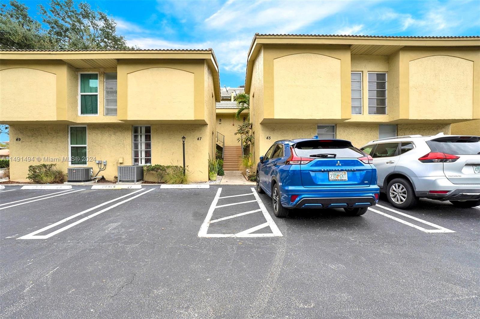 a view of a car parked in front of a house