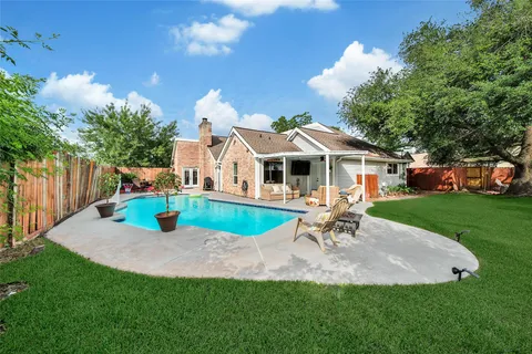 a view of a house with a yard porch and sitting area
