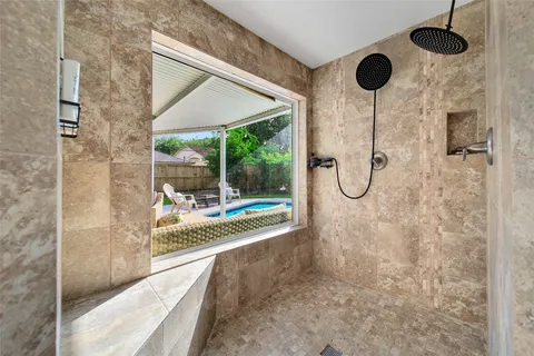 a bathroom with a shower and a bathtub