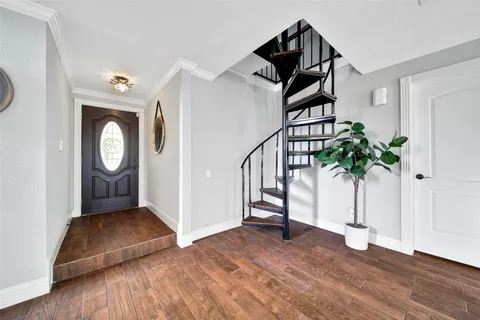 a view of entryway with wooden floor