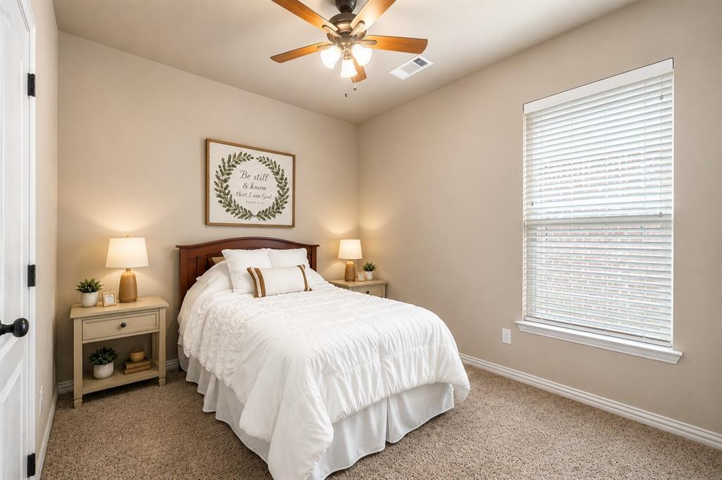 1852 Meadowview Canton, TX 75103 - Photo 19 of 28 a bedroom with a bed and a window