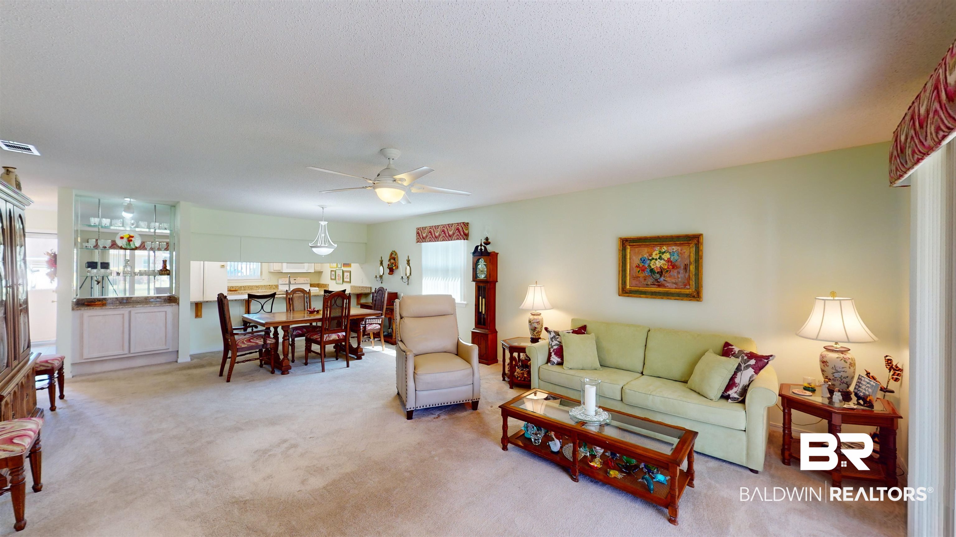 9445 Villas Drive Foley, AL 36535 - Photo 5 of 20 Carpeted living room with ceiling fan