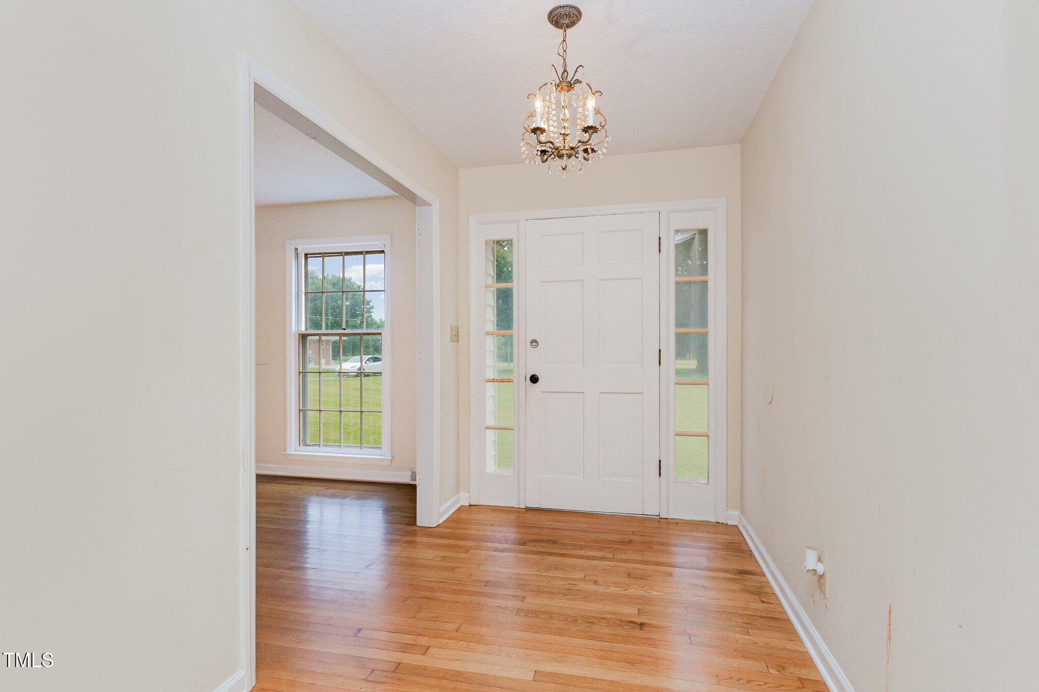 316 Cheeks Lane Graham, NC 27253 - Photo 14 of 52 wooden floor in an empty room with a window