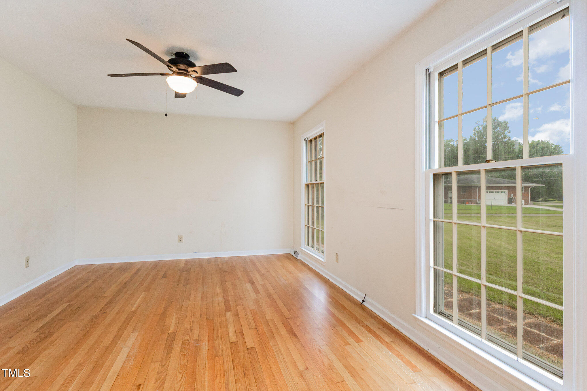 316 Cheeks Lane Graham, NC 27253 - Photo 15 of 52 a view of a room with wooden floor and windows