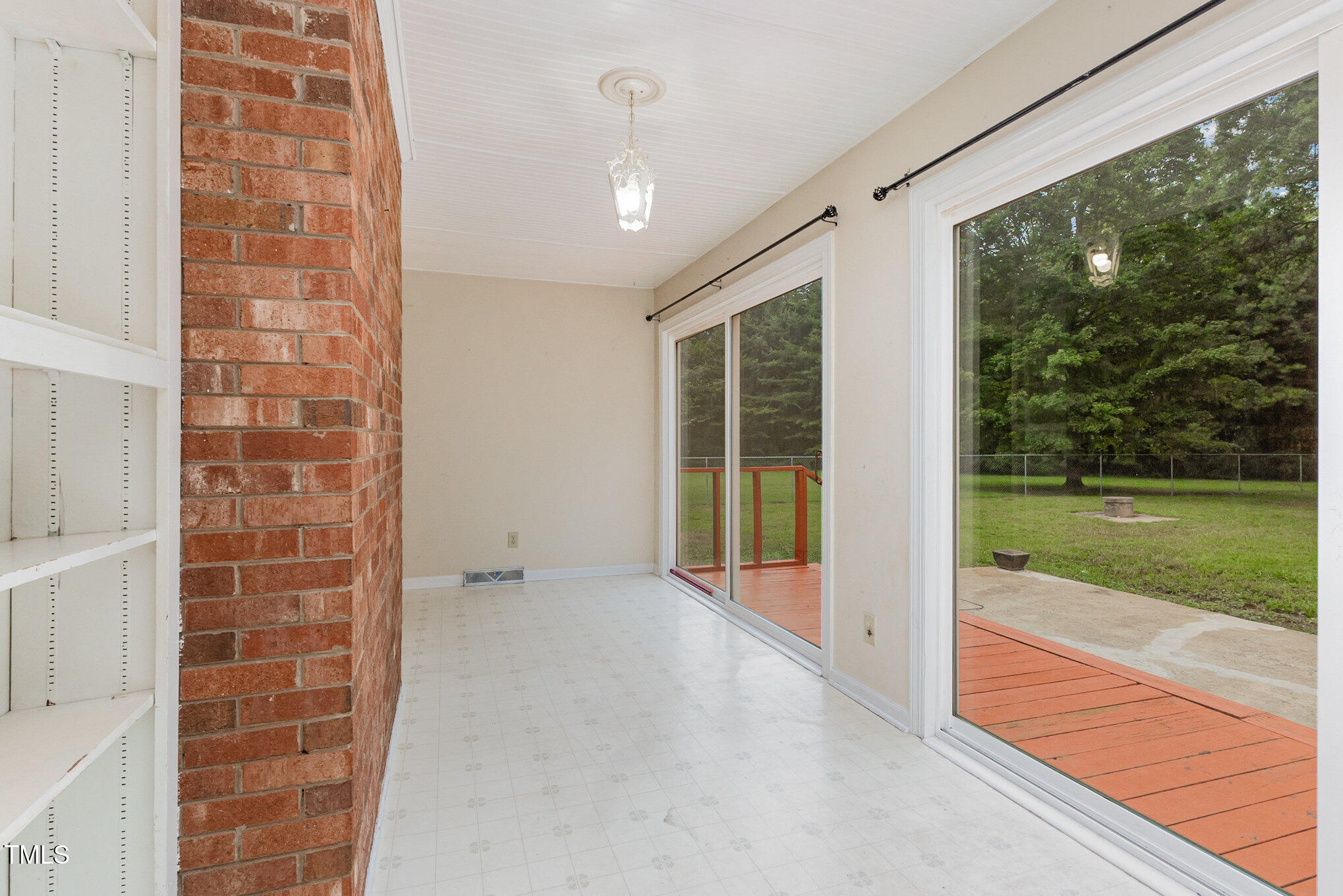 316 Cheeks Lane Graham, NC 27253 - Photo 20 of 52 a view of an empty room with glass door and balcony