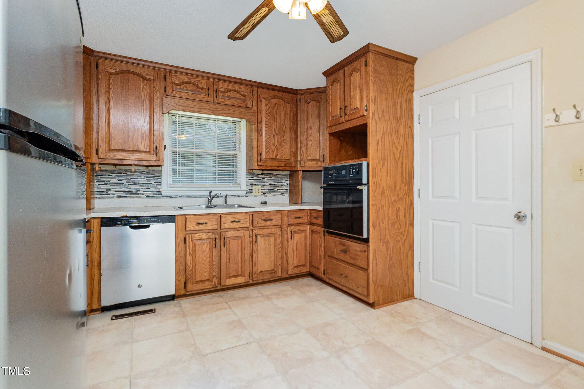 316 Cheeks Lane Graham, NC 27253 - Photo 25 of 52 a kitchen with stainless steel appliances granite countertop a stove a sink and a refrigerator