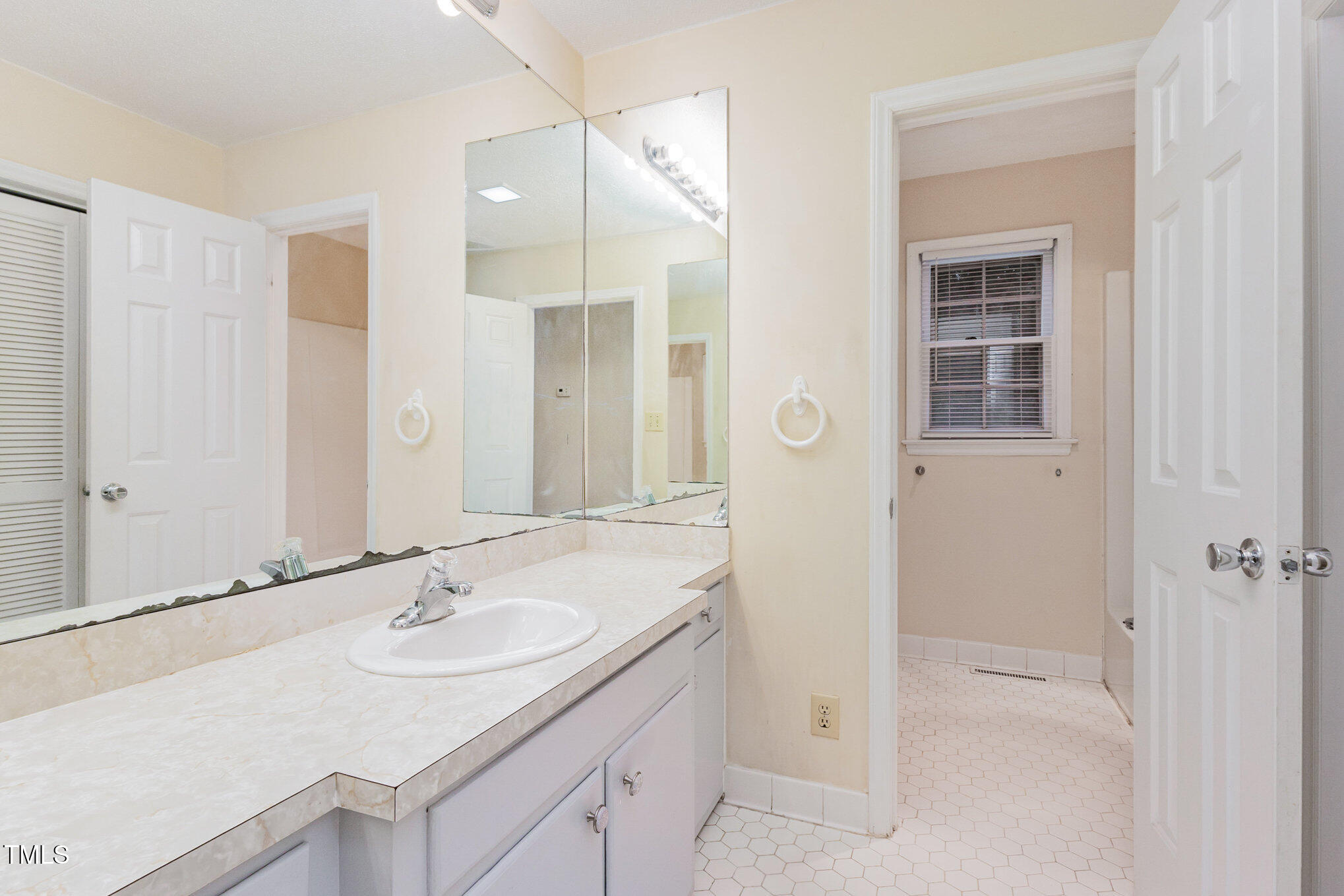 316 Cheeks Lane Graham, NC 27253 - Photo 30 of 52 a bathroom with a sink and a mirror